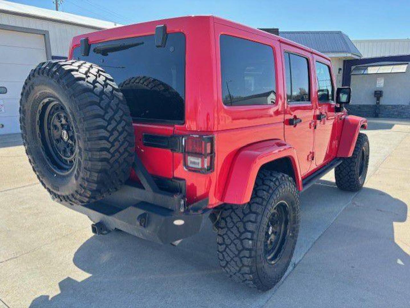 2015 RED JEEP WRANGLER UNLIMI SAHARA (1C4BJWEG2FL) with an 3.6L engine, Automatic transmission, located at 1100 W. Sheridan Ave., Shenandoah, 51601, (712) 246-1600, 40.765678, -95.388817 - Photo#1