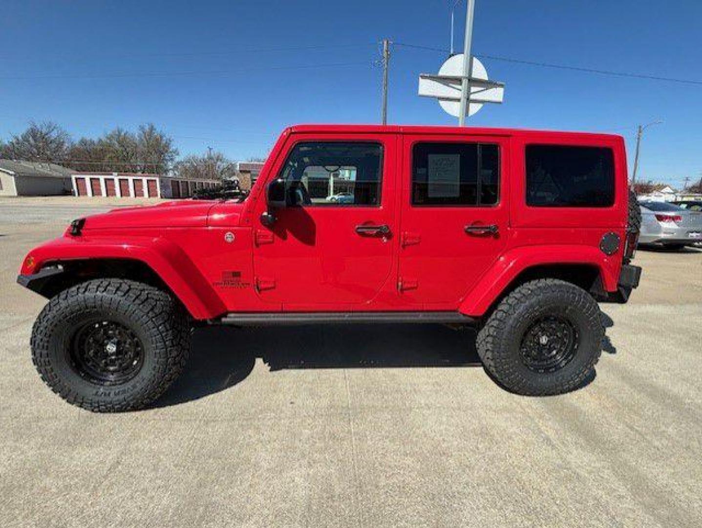 2015 RED JEEP WRANGLER UNLIMI SAHARA (1C4BJWEG2FL) with an 3.6L engine, Automatic transmission, located at 1100 W. Sheridan Ave., Shenandoah, 51601, (712) 246-1600, 40.765678, -95.388817 - Photo#2