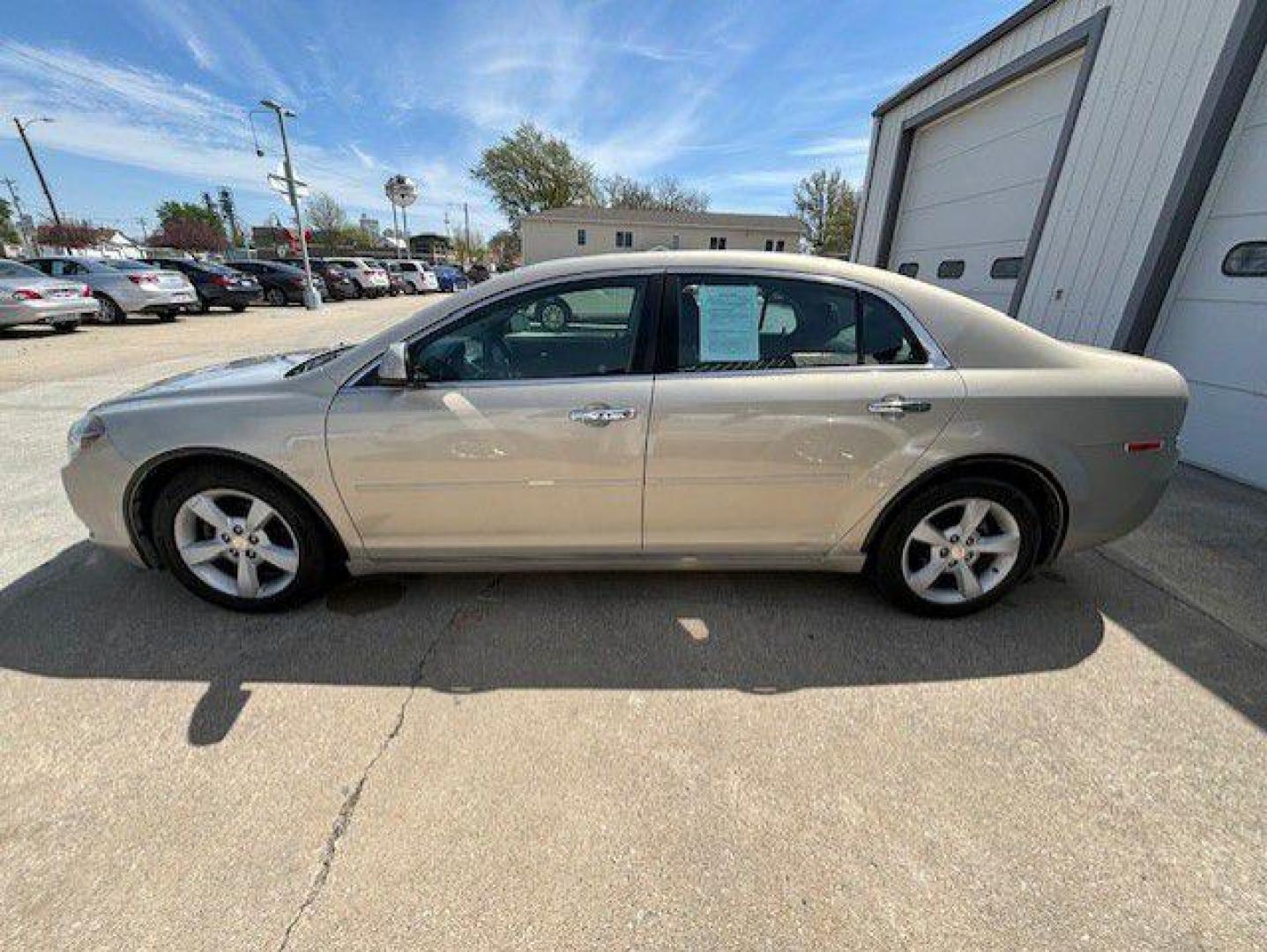 2012 GOLD CHEVROLET MALIBU 1LT (1G1ZC5E00CF) with an 2.4L engine, Automatic transmission, located at 1100 W. Sheridan Ave., Shenandoah, 51601, (712) 246-1600, 40.765678, -95.388817 - Photo#2