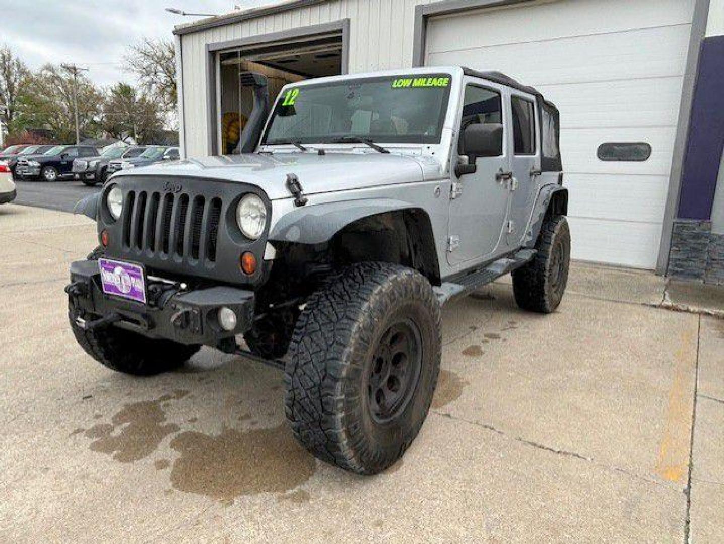 2012 SILVER JEEP WRANGLER UNLIMI SPORT (1C4BJWDG9CL) with an 3.6L engine, Automatic transmission, located at 1100 W. Sheridan Ave., Shenandoah, 51601, (712) 246-1600, 40.765678, -95.388817 - Photo#0