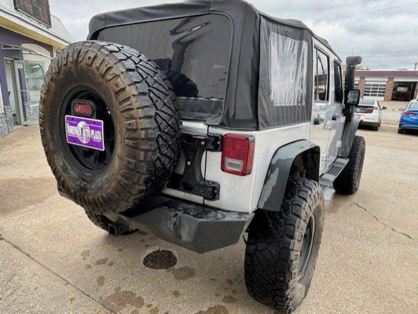 2012 SILVER JEEP WRANGLER UNLIMI SPORT (1C4BJWDG9CL) with an 3.6L engine, Automatic transmission, located at 1100 W. Sheridan Ave., Shenandoah, 51601, (712) 246-1600, 40.765678, -95.388817 - Photo#1