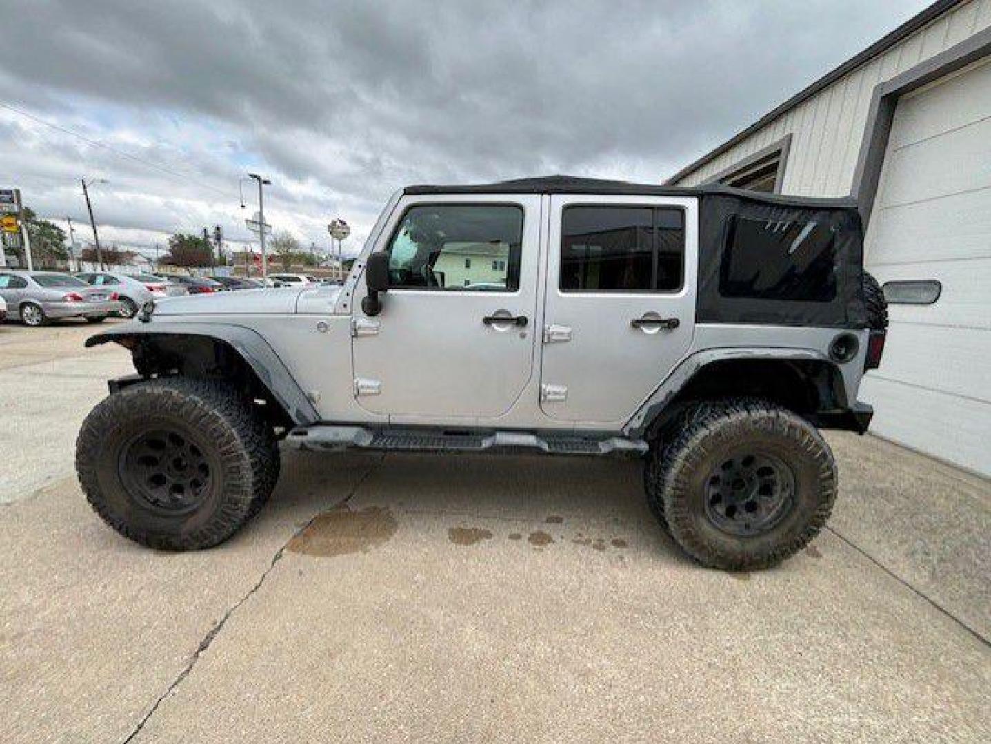 2012 SILVER JEEP WRANGLER UNLIMI SPORT (1C4BJWDG9CL) with an 3.6L engine, Automatic transmission, located at 1100 W. Sheridan Ave., Shenandoah, 51601, (712) 246-1600, 40.765678, -95.388817 - Photo#2