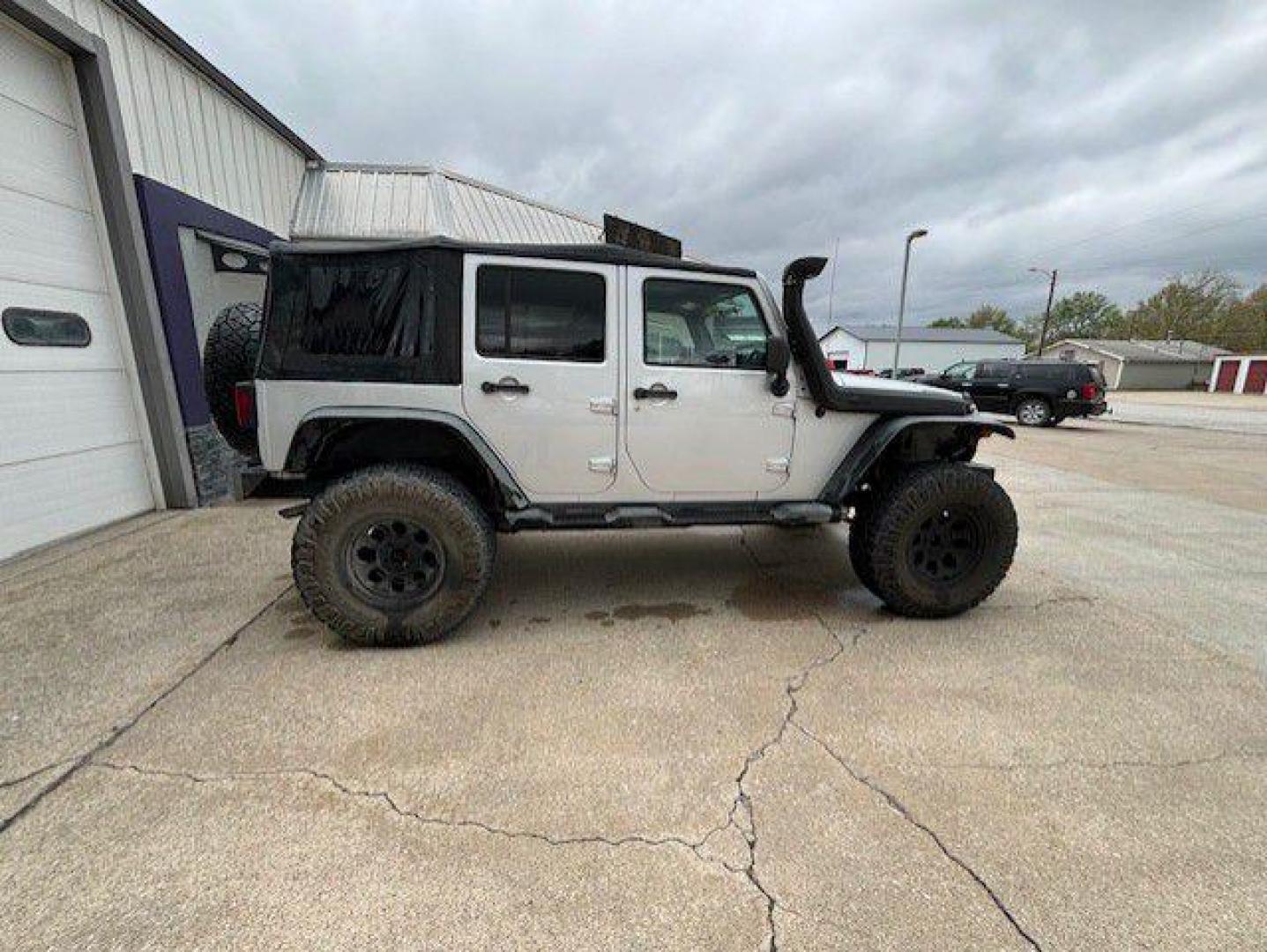 2012 SILVER JEEP WRANGLER UNLIMI SPORT (1C4BJWDG9CL) with an 3.6L engine, Automatic transmission, located at 1100 W. Sheridan Ave., Shenandoah, 51601, (712) 246-1600, 40.765678, -95.388817 - Photo#7