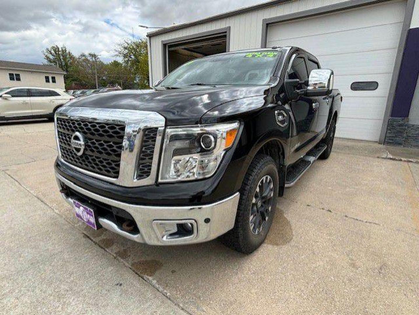 2017 BLACK NISSAN TITAN SV (1N6AA1E52HN) with an 5.6L engine, Automatic transmission, located at 1100 W. Sheridan Ave., Shenandoah, 51601, (712) 246-1600, 40.765678, -95.388817 - Photo#0