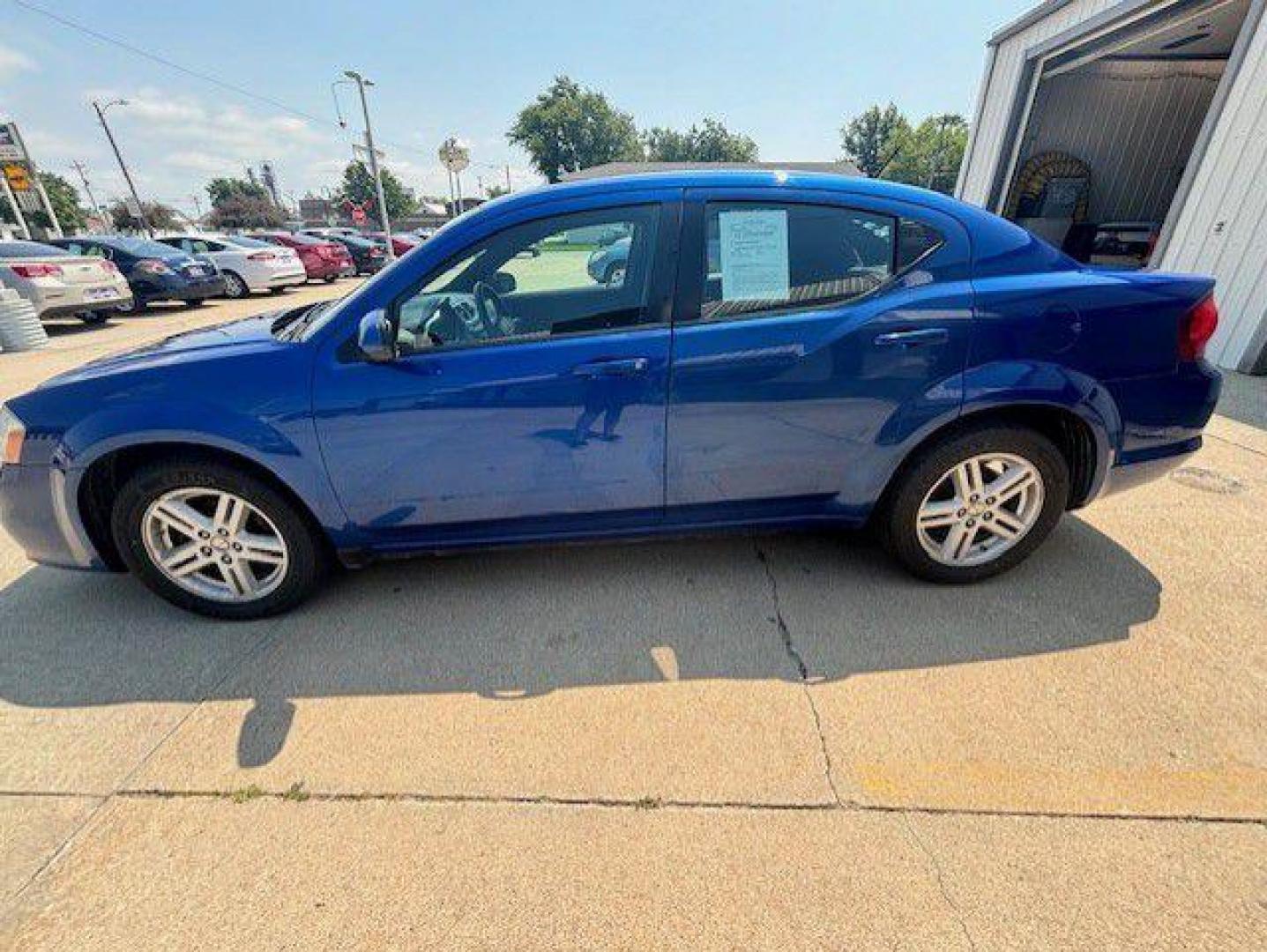 2012 BLUE DODGE AVENGER SXT (1C3CDZCB9CN) with an 2.4L engine, Automatic transmission, located at 1100 W. Sheridan Ave., Shenandoah, 51601, (712) 246-1600, 40.765678, -95.388817 - Photo#1