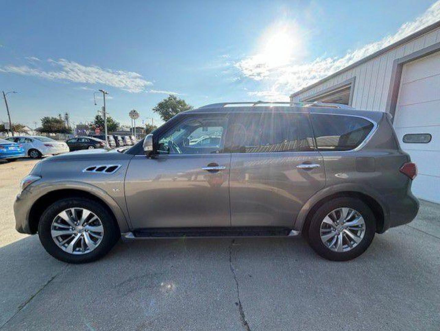 2015 BROWN INFINITI QX80 (JN8AZ2NE9F9) with an 5.6L engine, Automatic transmission, located at 1100 W. Sheridan Ave., Shenandoah, 51601, (712) 246-1600, 40.765678, -95.388817 - Photo#1