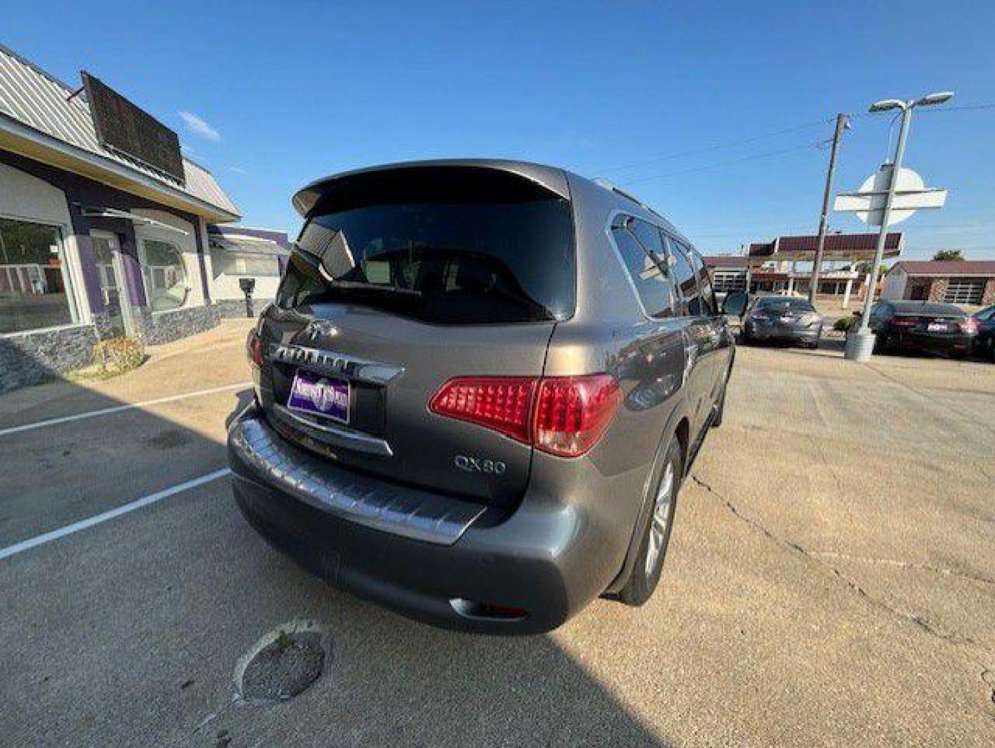 2015 BROWN INFINITI QX80 (JN8AZ2NE9F9) with an 5.6L engine, Automatic transmission, located at 1100 W. Sheridan Ave., Shenandoah, 51601, (712) 246-1600, 40.765678, -95.388817 - Photo#7