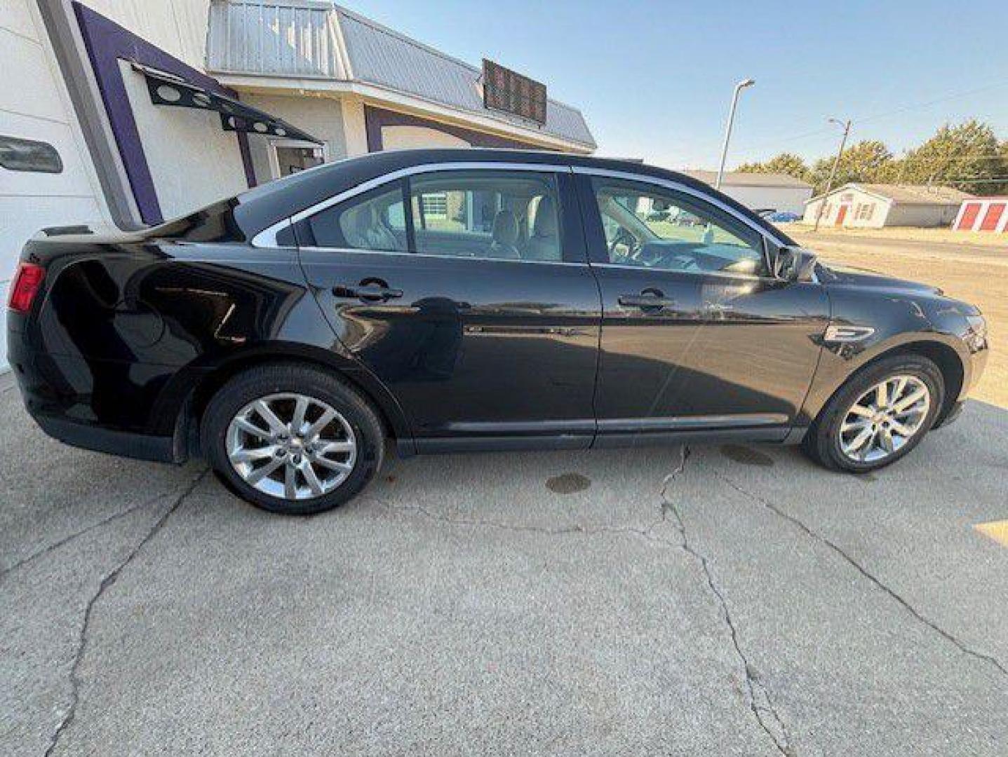 2013 BLACK FORD TAURUS SEL (1FAHP2E96DG) with an 2.0L engine, Automatic transmission, located at 1100 W. Sheridan Ave., Shenandoah, 51601, (712) 246-1600, 40.765678, -95.388817 - Photo#7