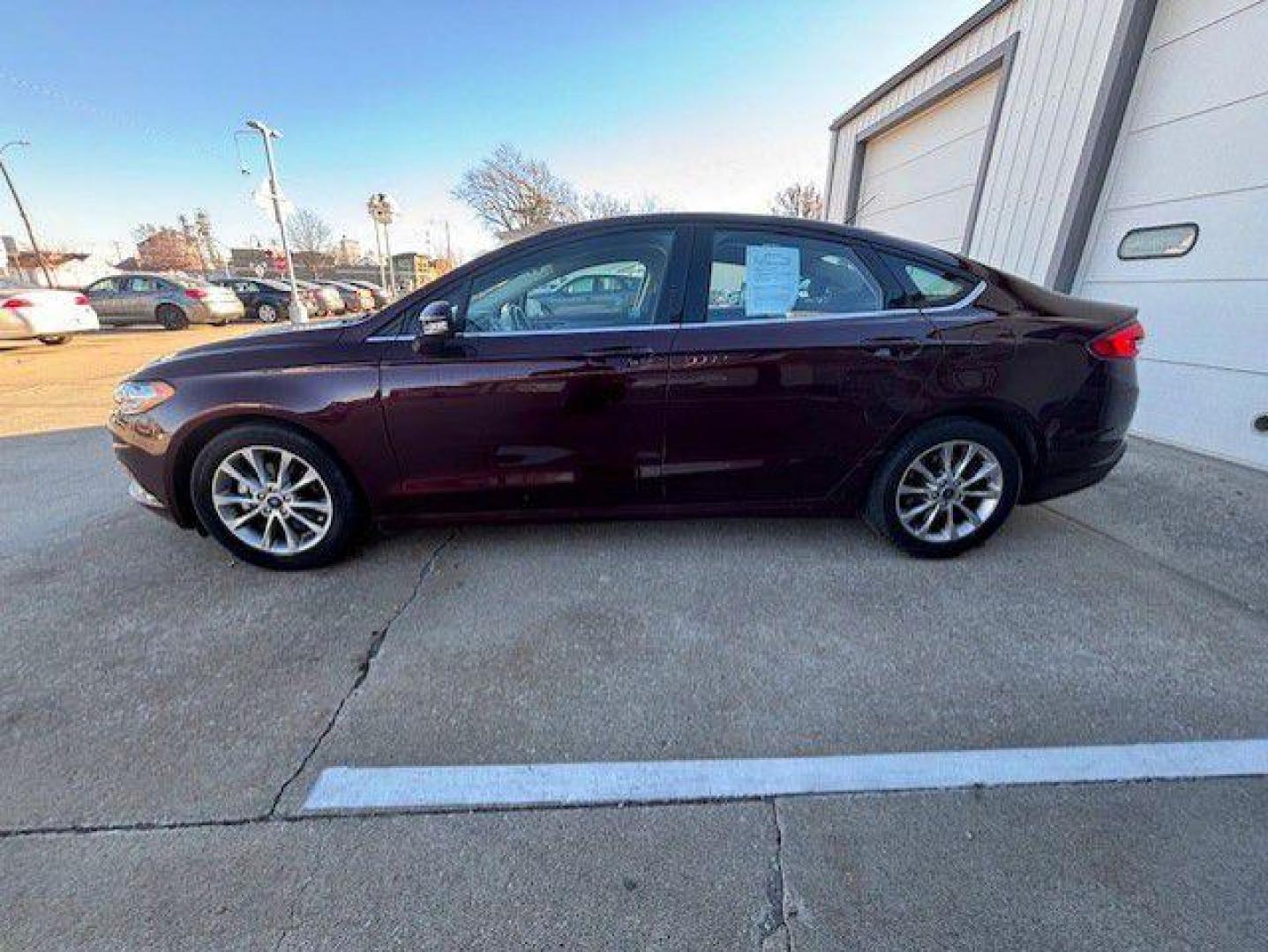 2017 MAROON FORD FUSION SE (3FA6P0H72HR) with an 2.5L engine, Automatic transmission, located at 1100 W. Sheridan Ave., Shenandoah, 51601, (712) 246-1600, 40.765678, -95.388817 - Photo#1