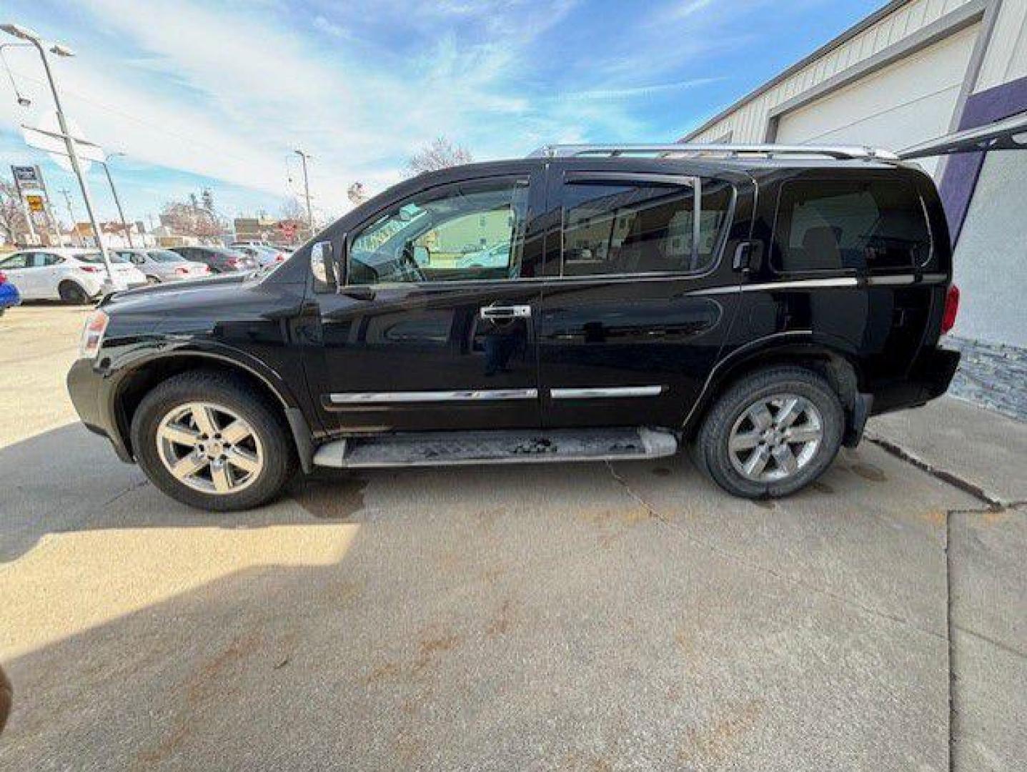 2012 BLACK NISSAN ARMADA SV (5N1BA0NE5CN) with an 5.6L engine, Automatic transmission, located at 1100 W. Sheridan Ave., Shenandoah, 51601, (712) 246-1600, 40.765678, -95.388817 - Photo#2