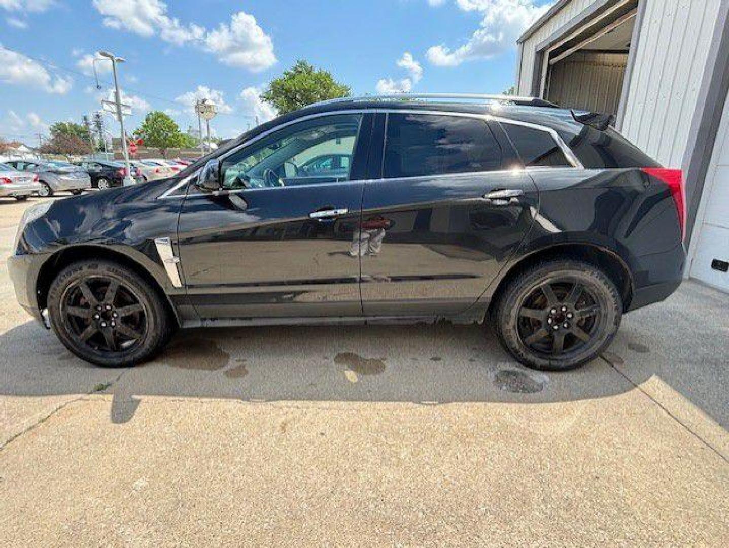 2011 BLACK CADILLAC SRX PERFORMANCE COLLECTION (3GYFNJE62BS) with an 2.8L engine, Automatic transmission, located at 1100 W. Sheridan Ave., Shenandoah, 51601, (712) 246-1600, 40.765678, -95.388817 - Photo#1