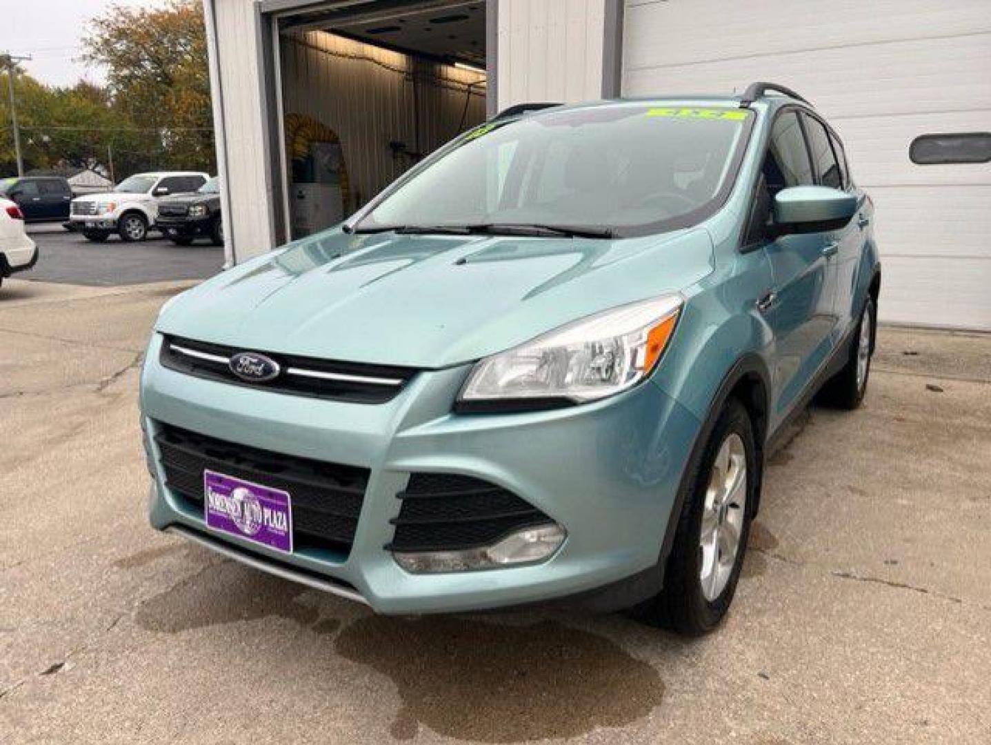 2013 GREEN FORD ESCAPE SE (1FMCU9GX7DU) with an 1.6L engine, Automatic transmission, located at 1100 W. Sheridan Ave., Shenandoah, 51601, (712) 246-1600, 40.765678, -95.388817 - Photo#0