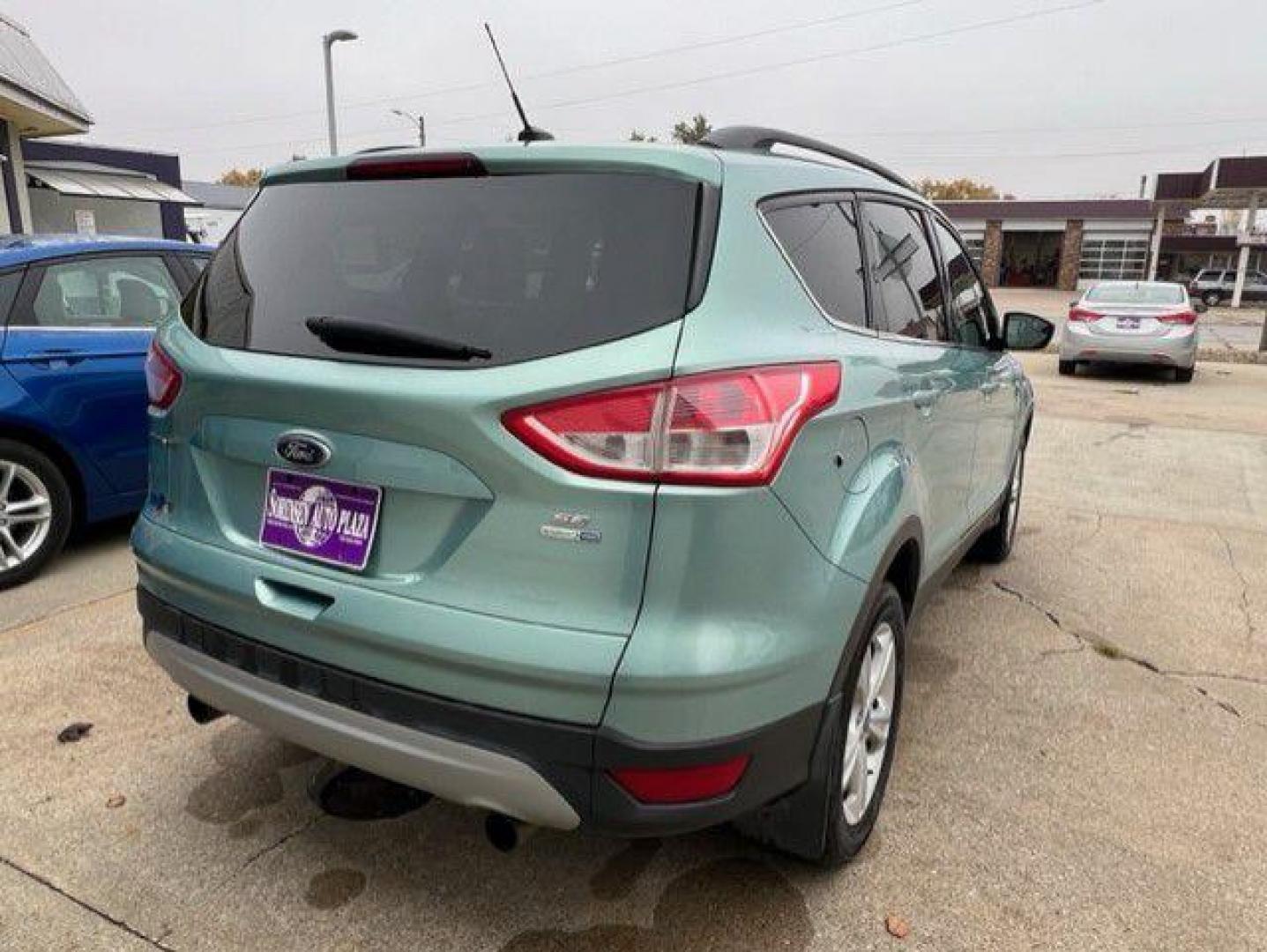 2013 GREEN FORD ESCAPE SE (1FMCU9GX7DU) with an 1.6L engine, Automatic transmission, located at 1100 W. Sheridan Ave., Shenandoah, 51601, (712) 246-1600, 40.765678, -95.388817 - Photo#1