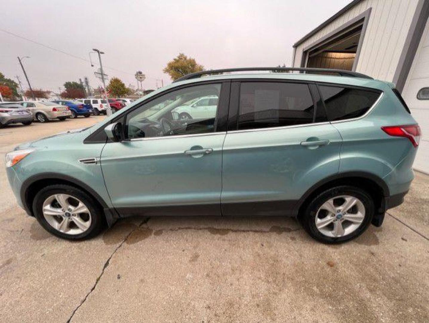 2013 GREEN FORD ESCAPE SE (1FMCU9GX7DU) with an 1.6L engine, Automatic transmission, located at 1100 W. Sheridan Ave., Shenandoah, 51601, (712) 246-1600, 40.765678, -95.388817 - Photo#2