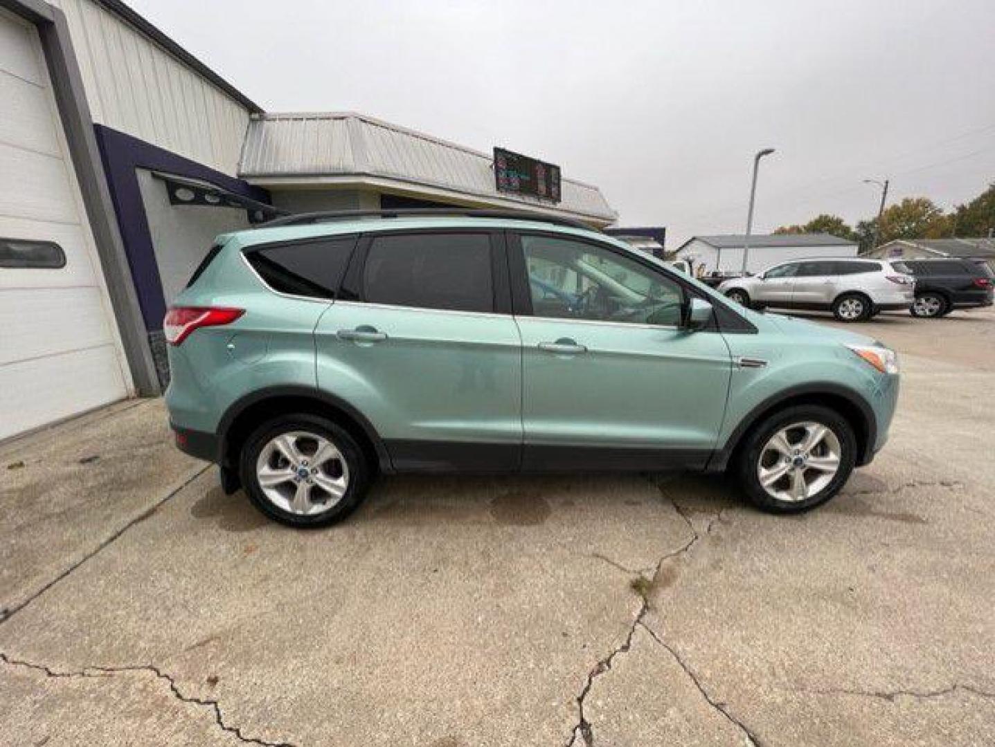 2013 GREEN FORD ESCAPE SE (1FMCU9GX7DU) with an 1.6L engine, Automatic transmission, located at 1100 W. Sheridan Ave., Shenandoah, 51601, (712) 246-1600, 40.765678, -95.388817 - Photo#6